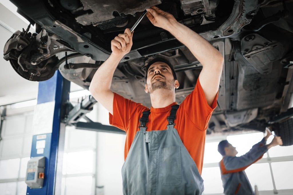 car-mechanics-working-and-maintaining-car